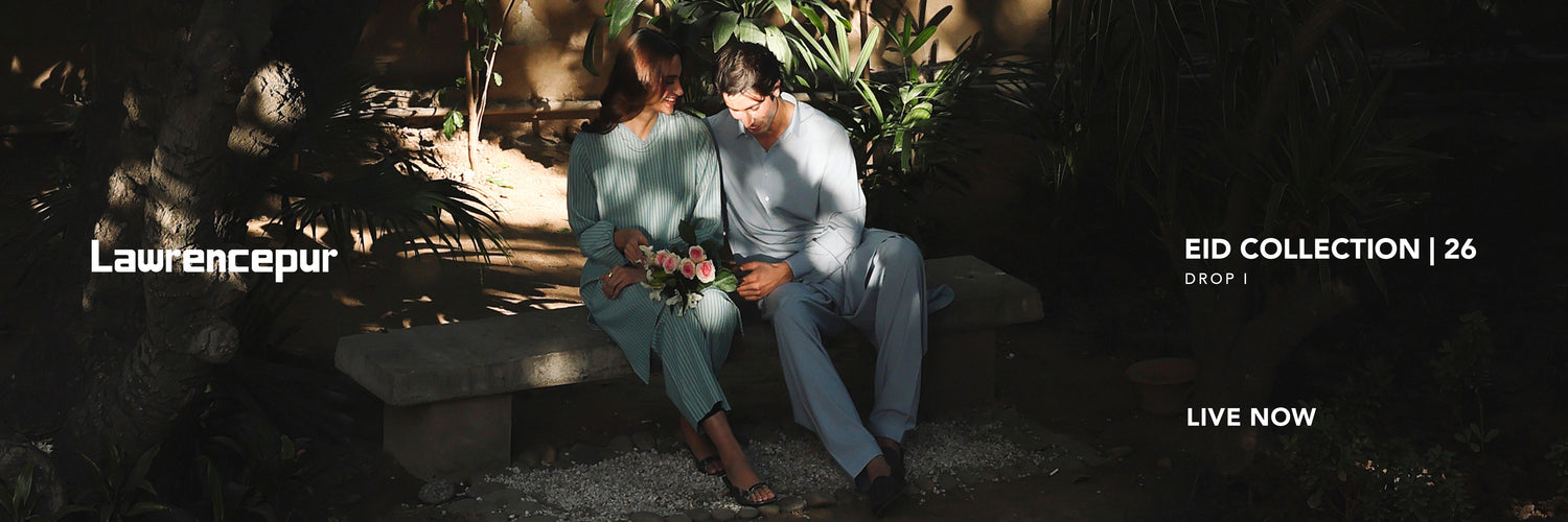 Elegant men wearing premium Eid shalwar kameez by Lawrencepur in a festive setting.